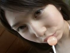 Horny student Kaori Ishii sucks a lollipop and desires to masturbate