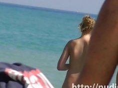 Sexy beach nudist women putting on lotion caught by spy cam